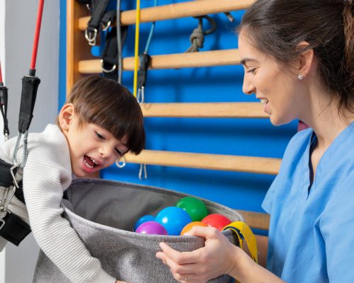 Disabled child is playing, learning and exercising in rehabilitation therapy hospital, Lifestyle of a child with disability. Happy disability kid concept .