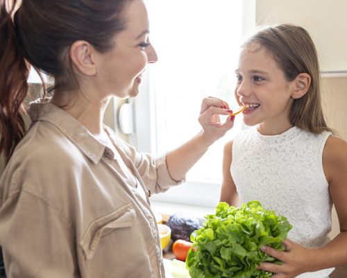 lovely-mother-daughter-together-kitchen
